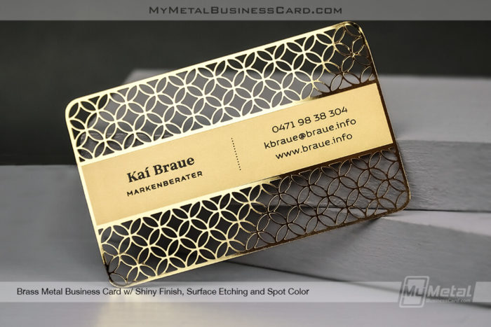 Shiny-Brass-Finish-Metal-Business-Card-With-Geometric-Cutout-Pattern