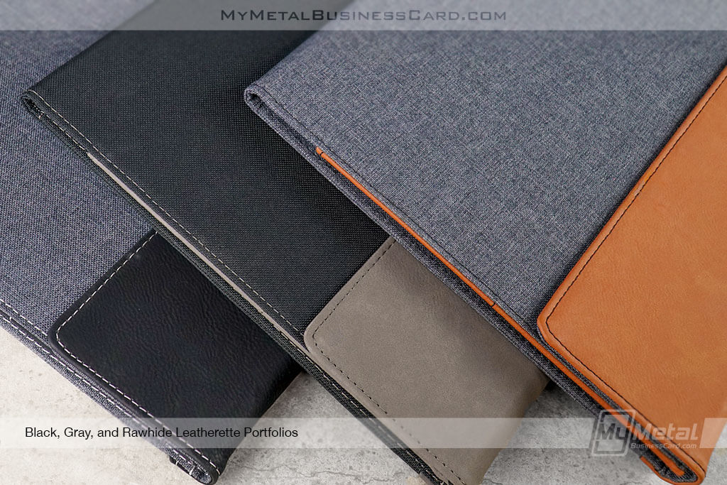 Close-Up-Shot-Of-Leatherette-Portfolios-Three-Colors-Black-Gray-Rawhide-Orange